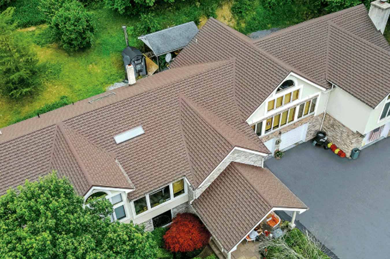 Eco-friendly stone-coated metal roof by Tilcor installed in Toledo, Ohio by Great Lakes Home Remodeling
