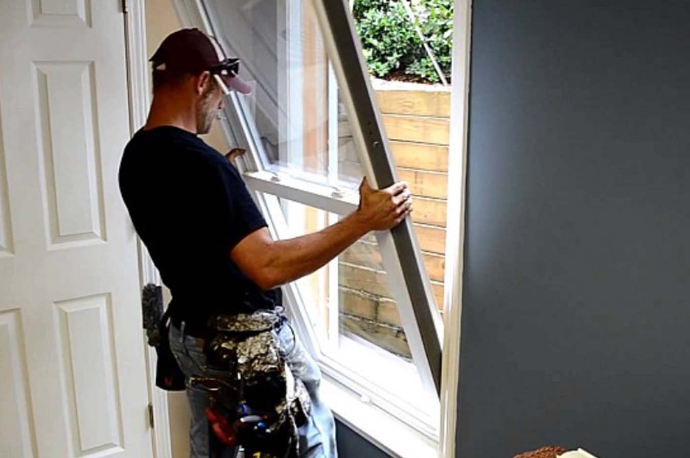 Professional Contractor Installing MI Windows in Detroit Michigan by Great Lakes Home Remodeling