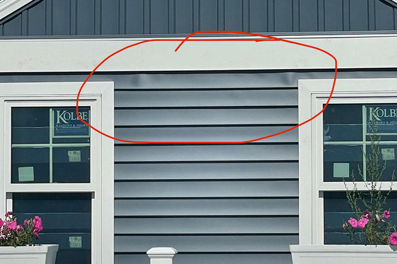 bubbling in blue vinyl siding in Avon, Ohio