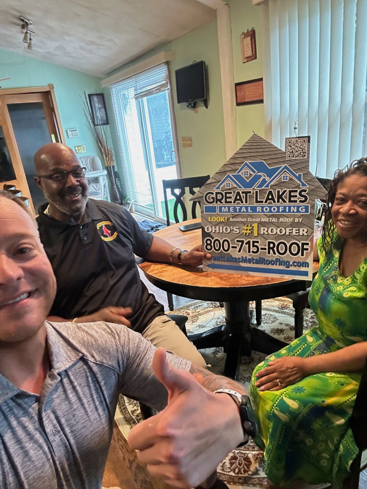 Happy customer with Great Lakes Home Remodeling sign