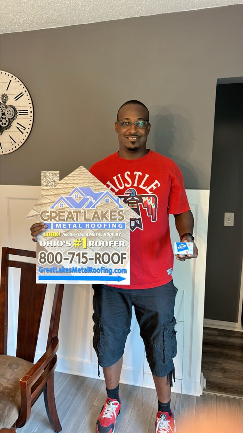 Happy customer with Great Lakes Home Remodeling sign