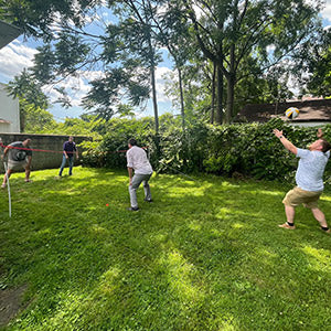 Great Lakes Home Remodeling team playing volleyball