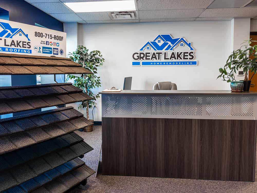 Great Lakes Home Remodeling office interior with reception desk and product display.