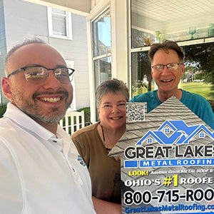 Happy customer with Great Lakes Home Remodeling sign