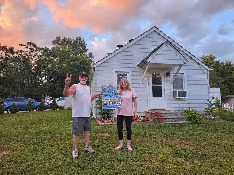 Happy customer with Great Lakes Home Remodeling sign